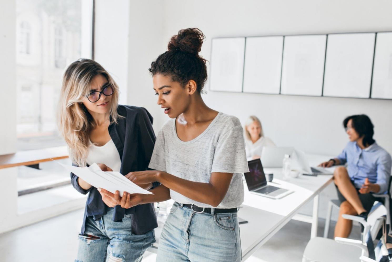 Business professionals analyzing financial documents and planning strategies